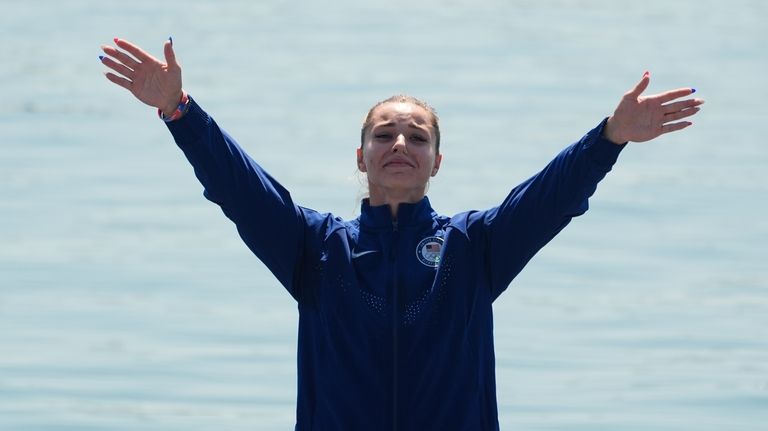 Nevin Harrison, of the United States, celebrates winning silver medal...