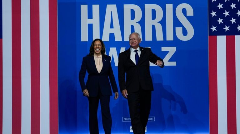 Democratic presidential nominee Vice President Kamala Harris and her running...