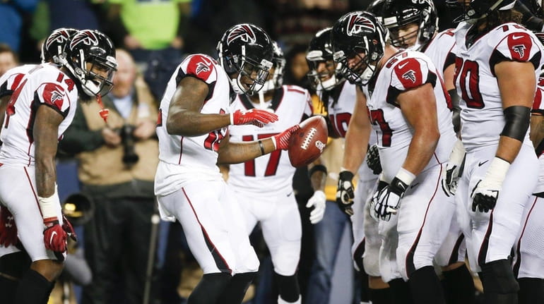 Mohamed Sanu of the Falcons celebrates a touchdown against the...