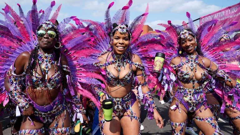 Dancers prepare to take part in the Notting Hill Carnival...