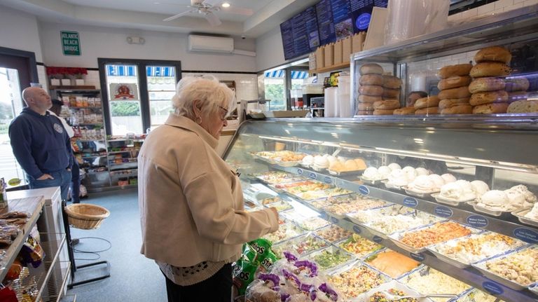 Maryann Anderson mulls an order at Boardwalk Bagel and Delicatessen...