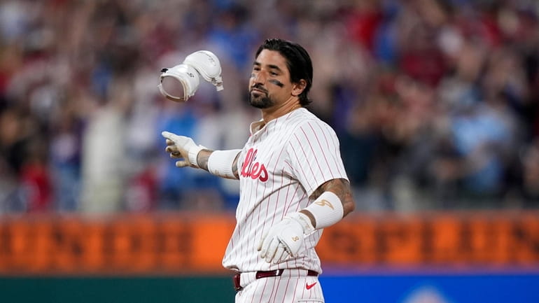 Philadelphia Phillies' Nick Castellanos reacts after hitting a game-winning RBI-double...