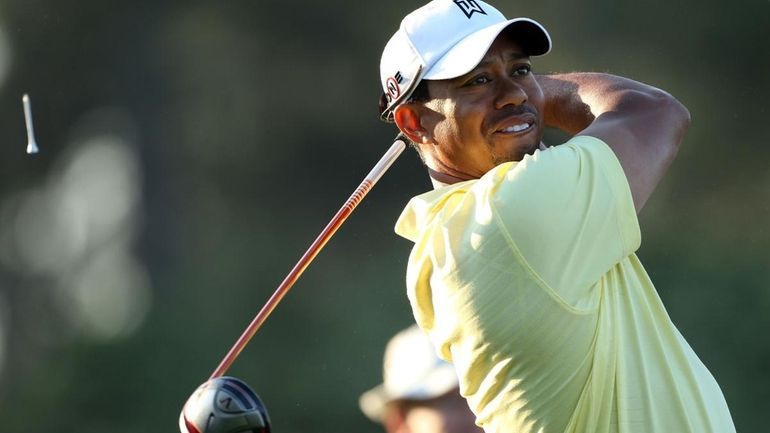 Tiger Woods plays a shot during a practice round prior...