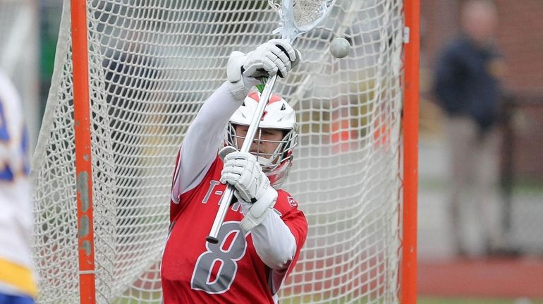 Connetquot's Andrew Pinto (8) makes a save in the third...