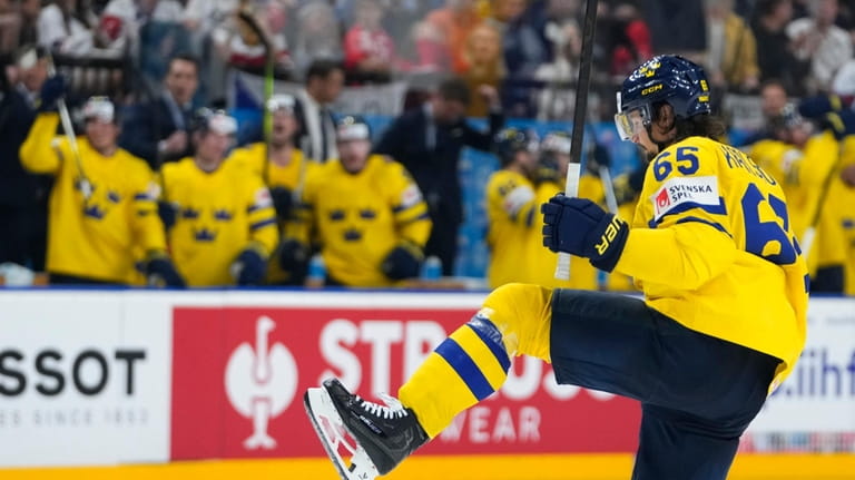 Sweden's Erik Karlsson celebrates after scoring his sides second goal...