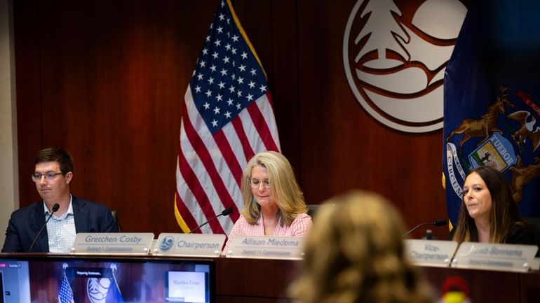 Members of the Ottawa County, Mich., Board of Commissioners, from...