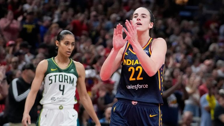 Indiana Fever's Caitlin Clark (22) reacts in front of Seattle...