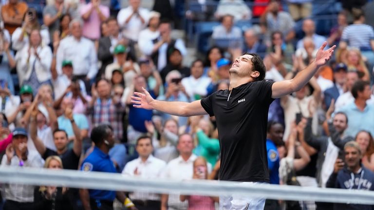 Taylor Fritz, of the United States, reacts after defeating Alexander...