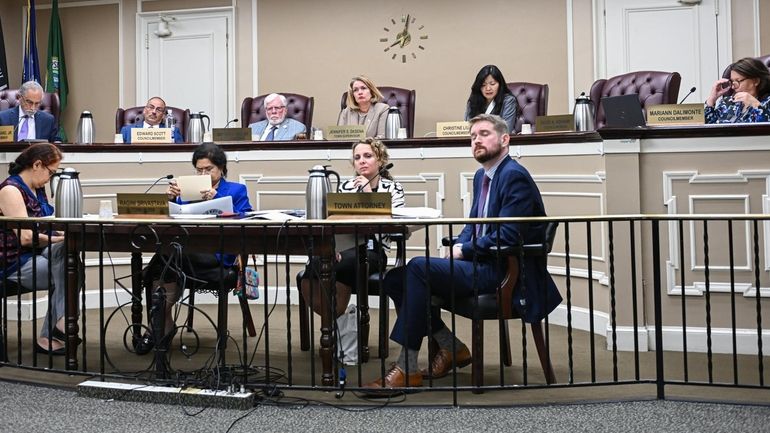 North Hempstead Town Supervisor Jennifer DeSena, center, and other town...