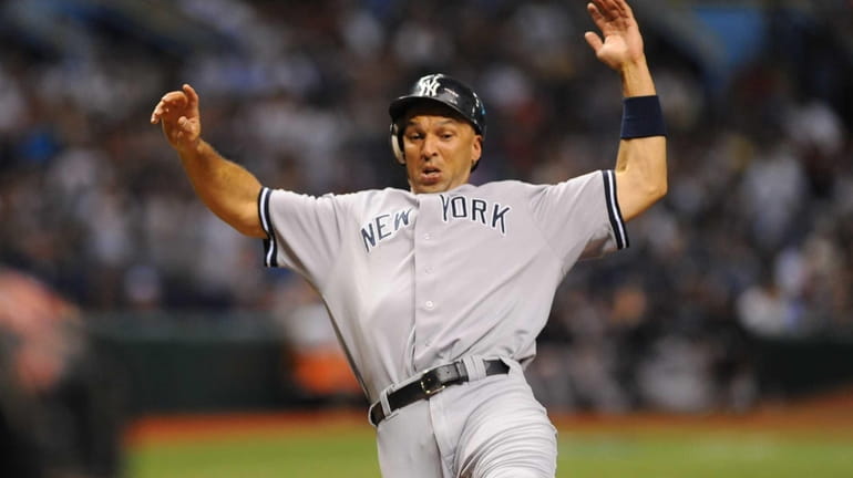 Raul Ibanez scores a run during the fourth inning. (July...