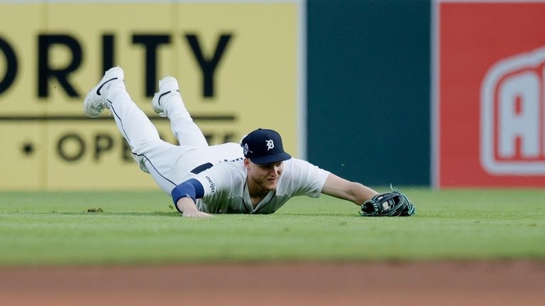 Detroit Tigers center fielder Parker Meadows makes a catch on...