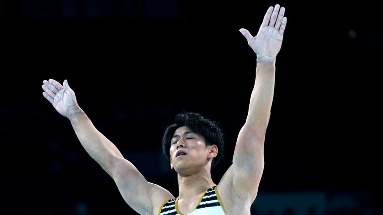 Daiki Hashimoto, of Japan, celebrates after performing on the pommel...