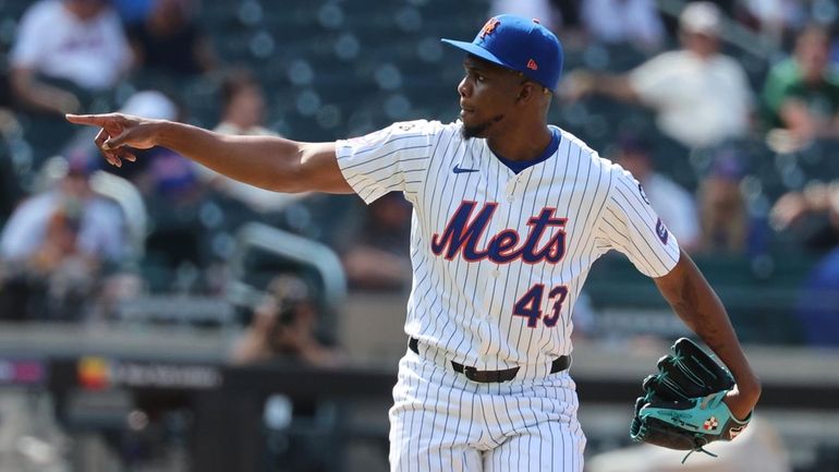 Mets pitcher Huascar Brazoban throws during the ninth inning against...