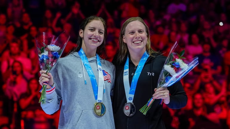 Lilly King and Kate Douglass celebrate after the Women's 200...