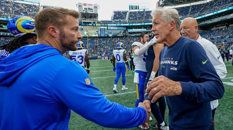 Los Angeles Rams head coach Sean McVay shakes hands with...