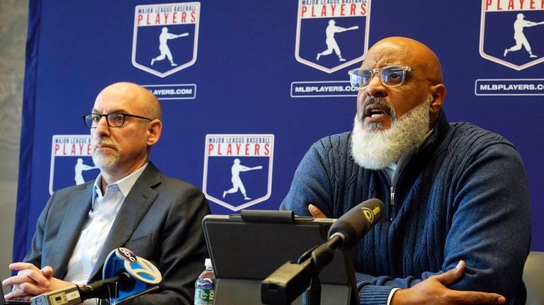 Major League Baseball Players Association Executive Director Tony Clark, right,...