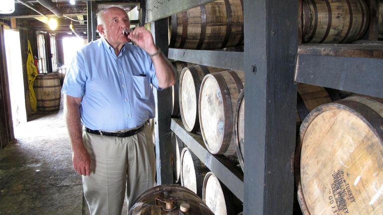 FILE- Wild Turkey master distiller Jimmy Russell takes a sip...