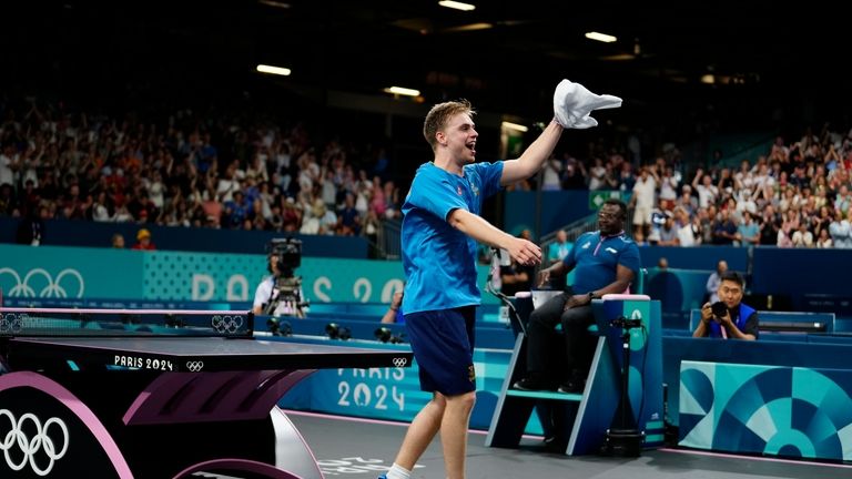 Sweden's Truls Moregrad reacts after his win against China's Wang...