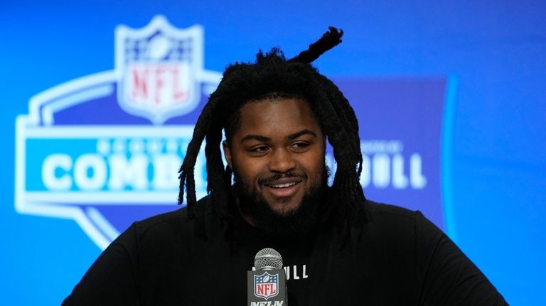 Illinois defensive lineman Johnny Newton speaks during a news conference...