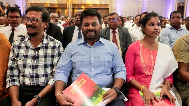 Anura Kumara Dissanayake, center, presidential candidate of opposition political party...