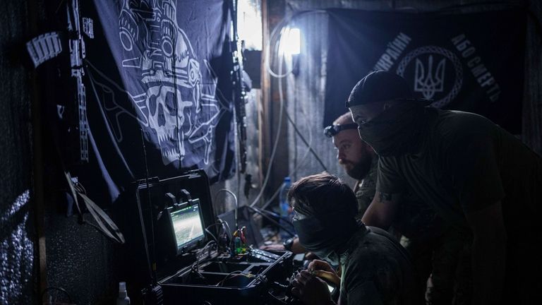 Ukrainian soldiers of 3rd assault brigade fly by an FPV...