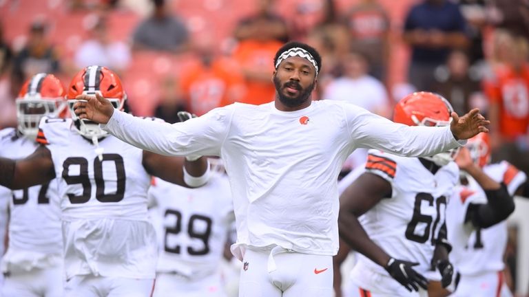 Cleveland Browns defensive back Myles Garrett stretches before an NFL...