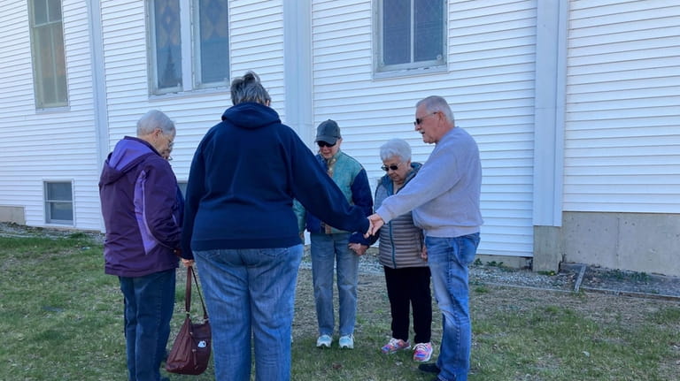 Friends of shooting victim Patricia Eger gather at a Christian...
