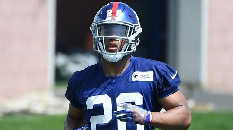 Giants running back Saquon Barkley participates during OTAs on May...