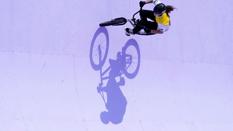 Queen Saray Villegas Serna, of Colombia, competes in the cycling...