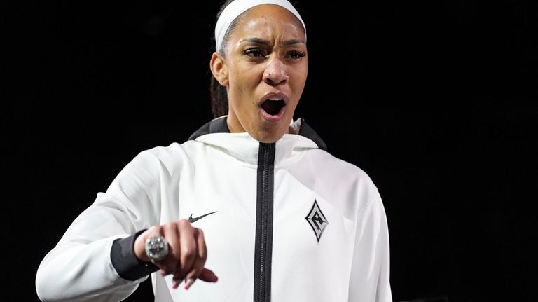 Las Vegas Aces center A'ja Wilson (22) reacts as she...