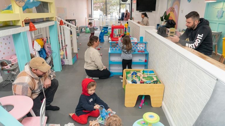 Parents and caretakers during a play session at Little Bean...