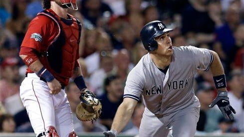 New York Yankees' Mark Teixeira watches his two-run triple next...