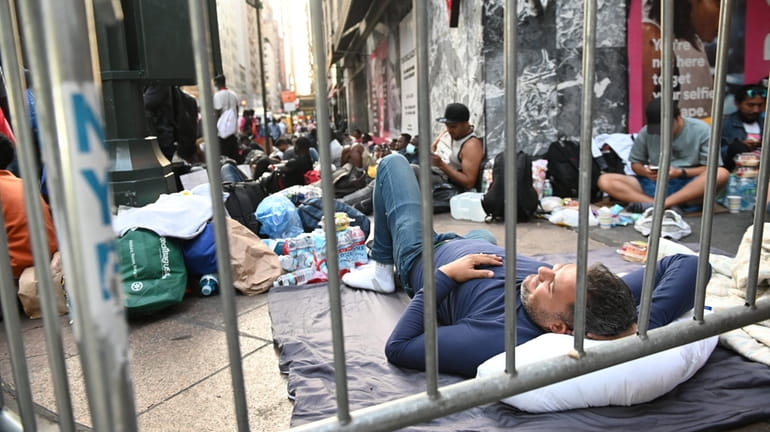 Hundreds of migrants slept on sidewalks outside of the Roosevelt Hotel...