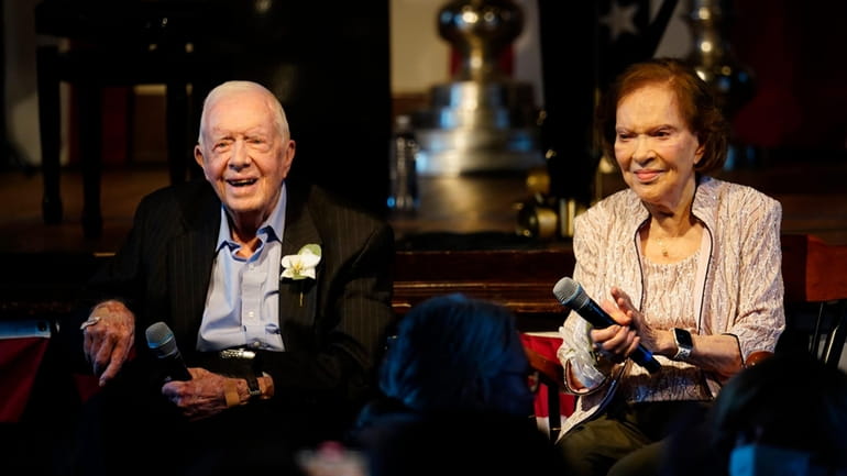 FILE- Former President Jimmy Carter and his wife former First...