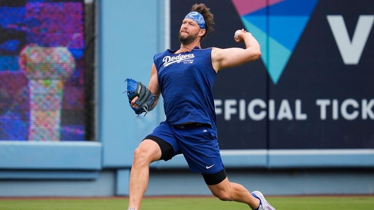 Los Angeles Dodgers' Clayton Kershaw works out before a baseball...