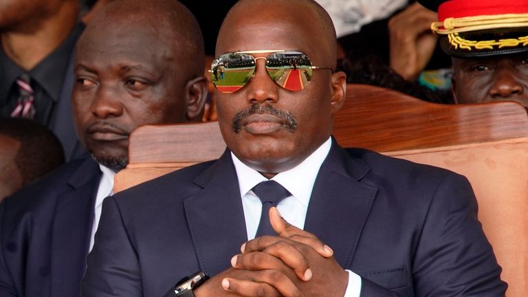 Outgoing president Joseph Kabila sits during the inauguration ceremony for...