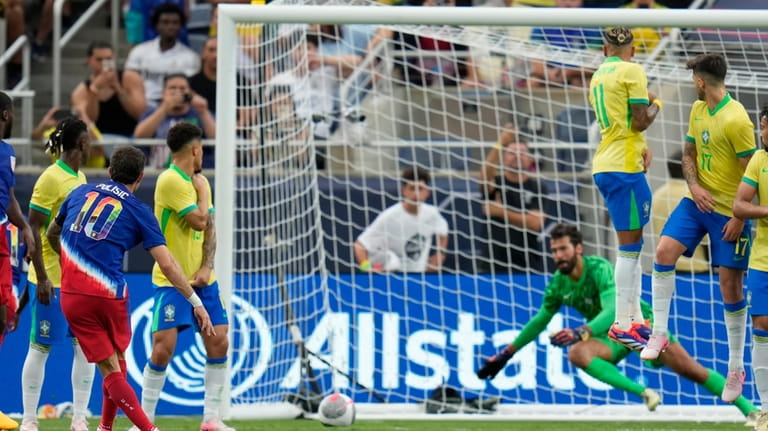 U.S. forward Christian Pulisic (10) scores a goal past Brazil...