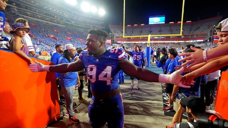 Florida defensive lineman Tyreak Sapp (94) greets fans as he...