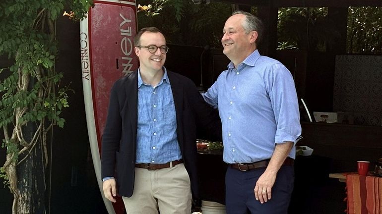 Chasten Buttigieg, left, and second gentleman Doug Emhoff at a...