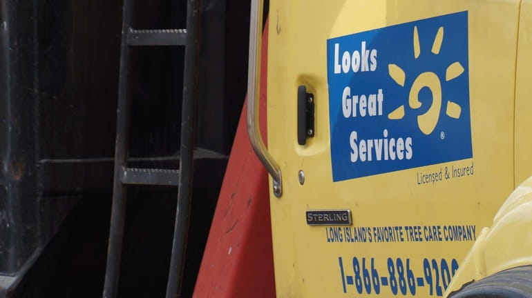 Trucks with the Looks Great Services logo are parked in...