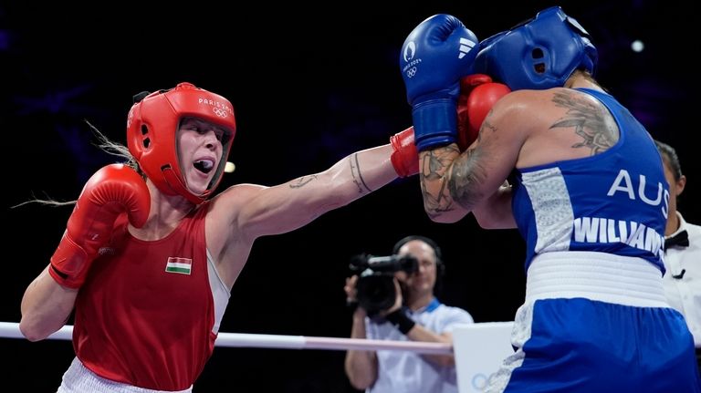 Hungary's Anna Hamori, left, fights Australia's Marissa Williamson in their...