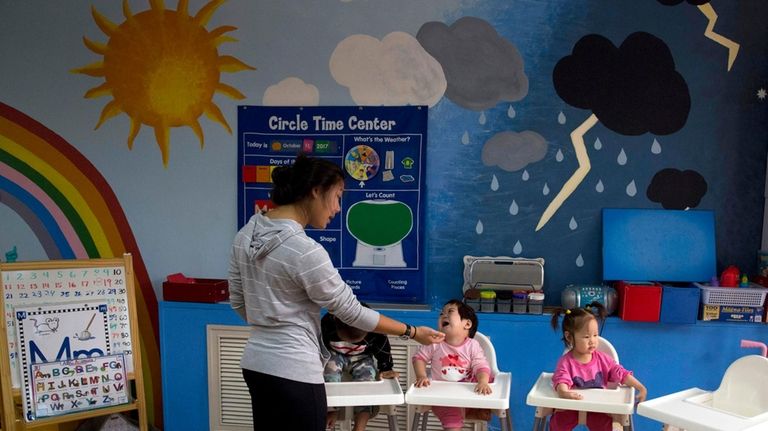 Children attend classes at a foster home of the New...