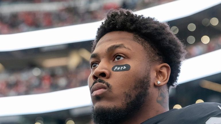 Las Vegas Raiders running back Josh Jacobs (28) stands on...