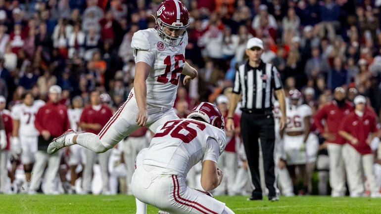 Alabama kicker Will Reichard (16) kicks a 22-yard field goal...