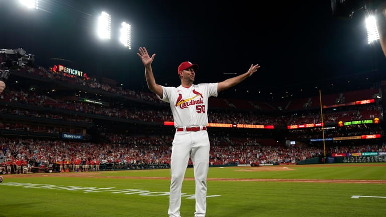 ;St. Louis Cardinals starting pitcher Adam Wainwright celebrates after earning...