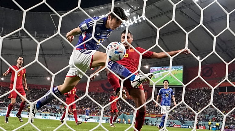Japan's Ao Tanaka scores his side's second goal during the...