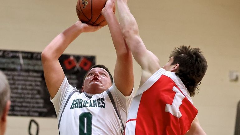 Westhampton forward Andrew Mensch puts back the rebound for two...