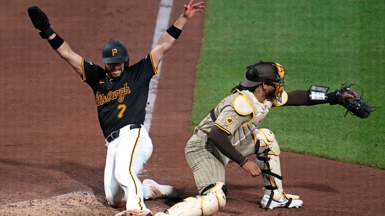 San Diego Padres catcher Luis Campusano, right, gets the force...