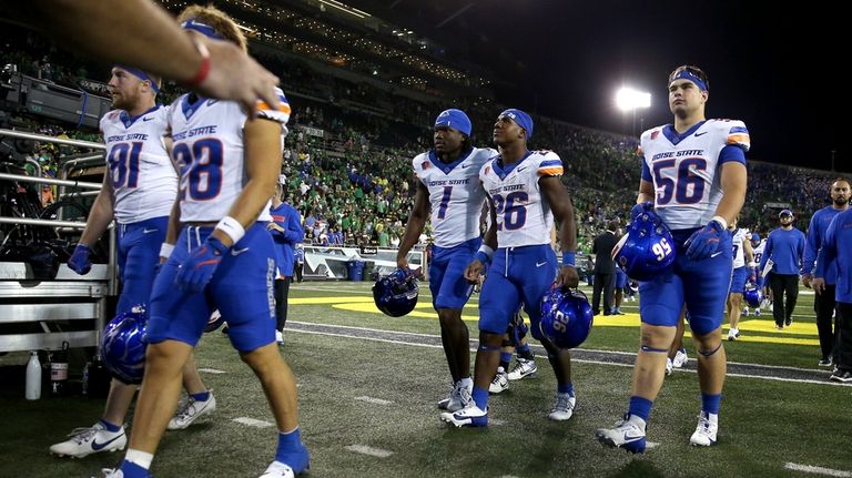 Boise State players leave the field after a loss to...