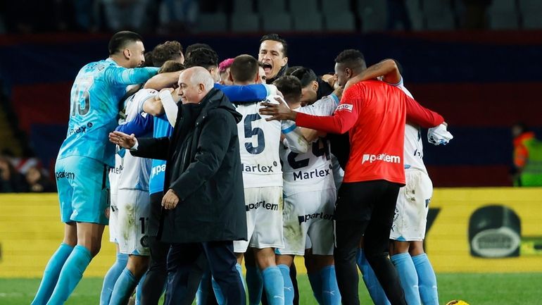 Girona's team players celebrate after the Spanish La Liga soccer...